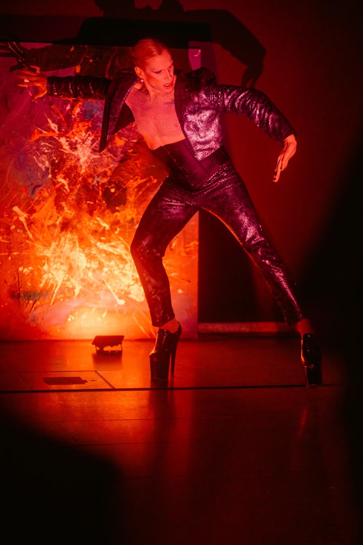 Performance — flame and figure.